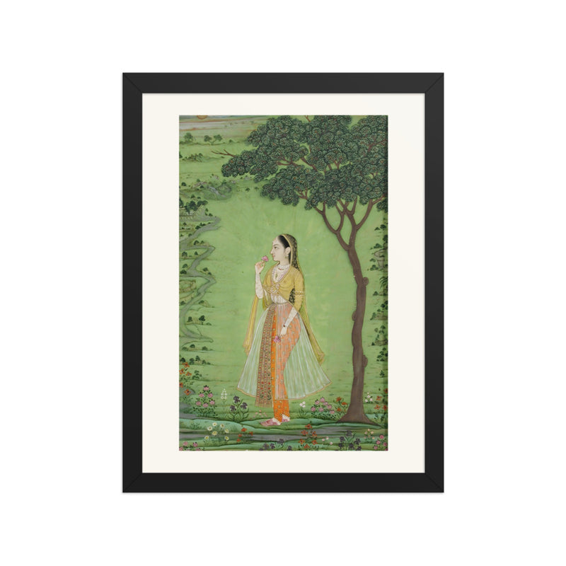 A woman standing by a tree, holding a flower