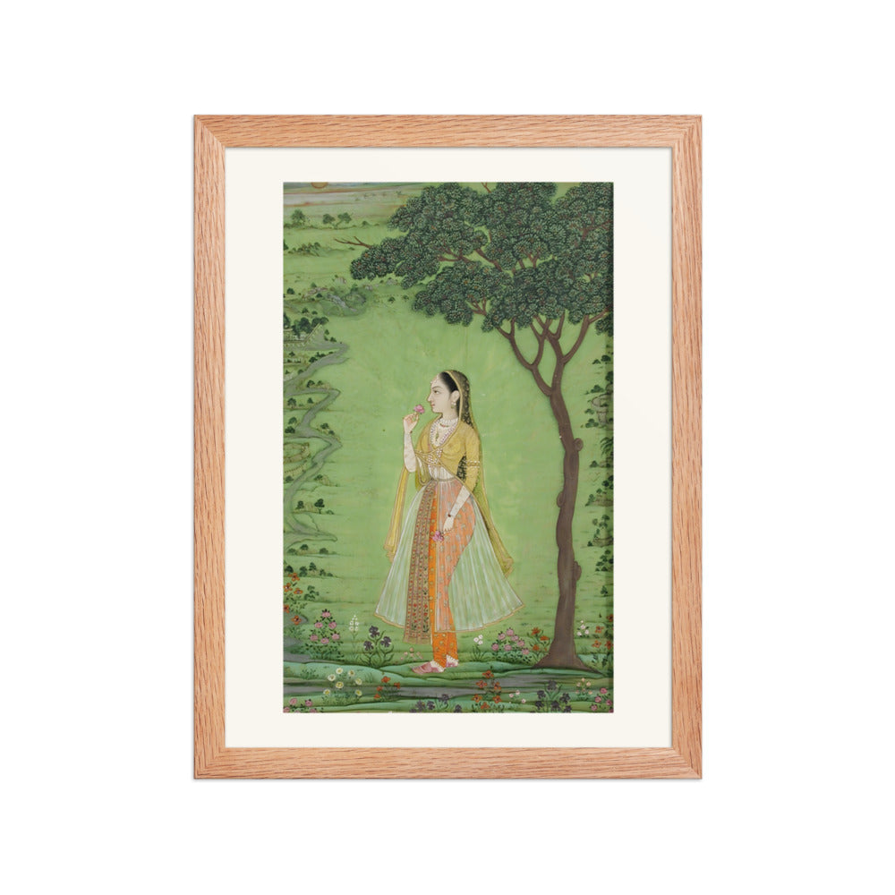 A woman standing by a tree, holding a flower — view 2