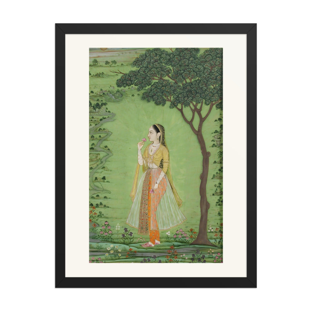 A woman standing by a tree, holding a flower — view 4